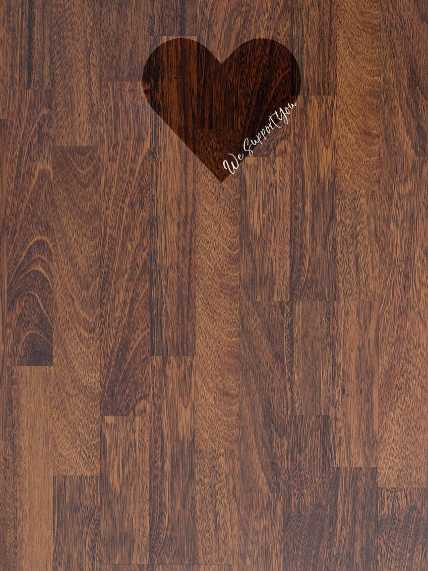 Family playing games in a living room with a hardwood floor